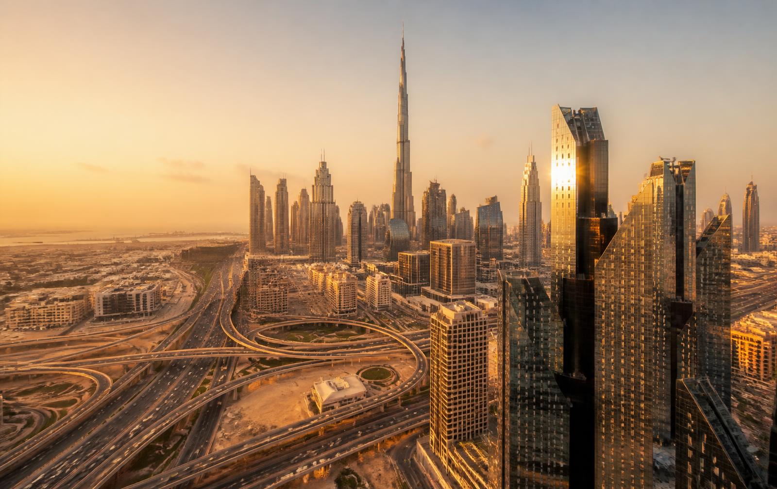 Dubai skyline at golden hour with Burj Khalifa and desert light